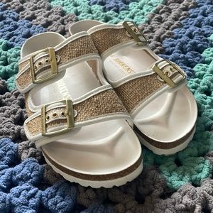 Gold and white Birkenstock